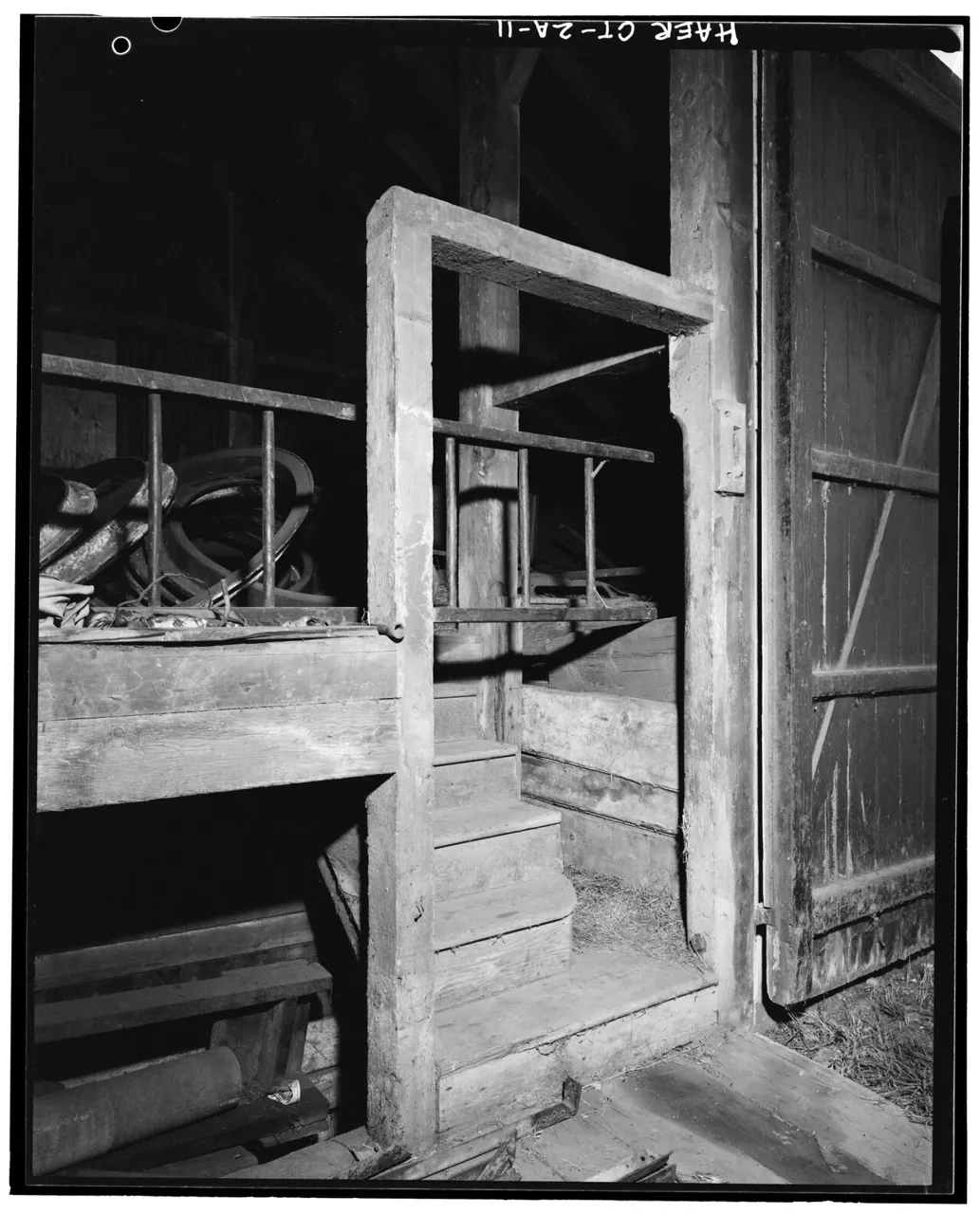 Barn interior steps, opening and stall partitions. 