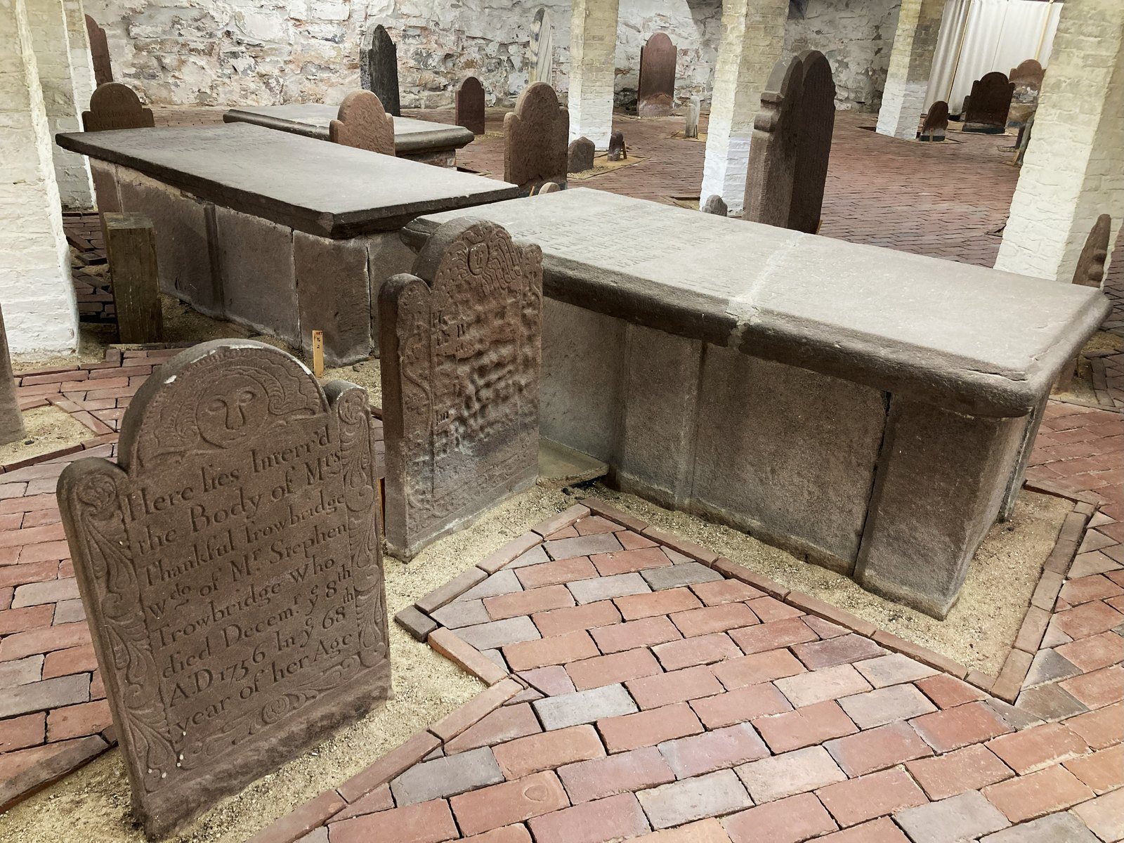Graves inside a later building