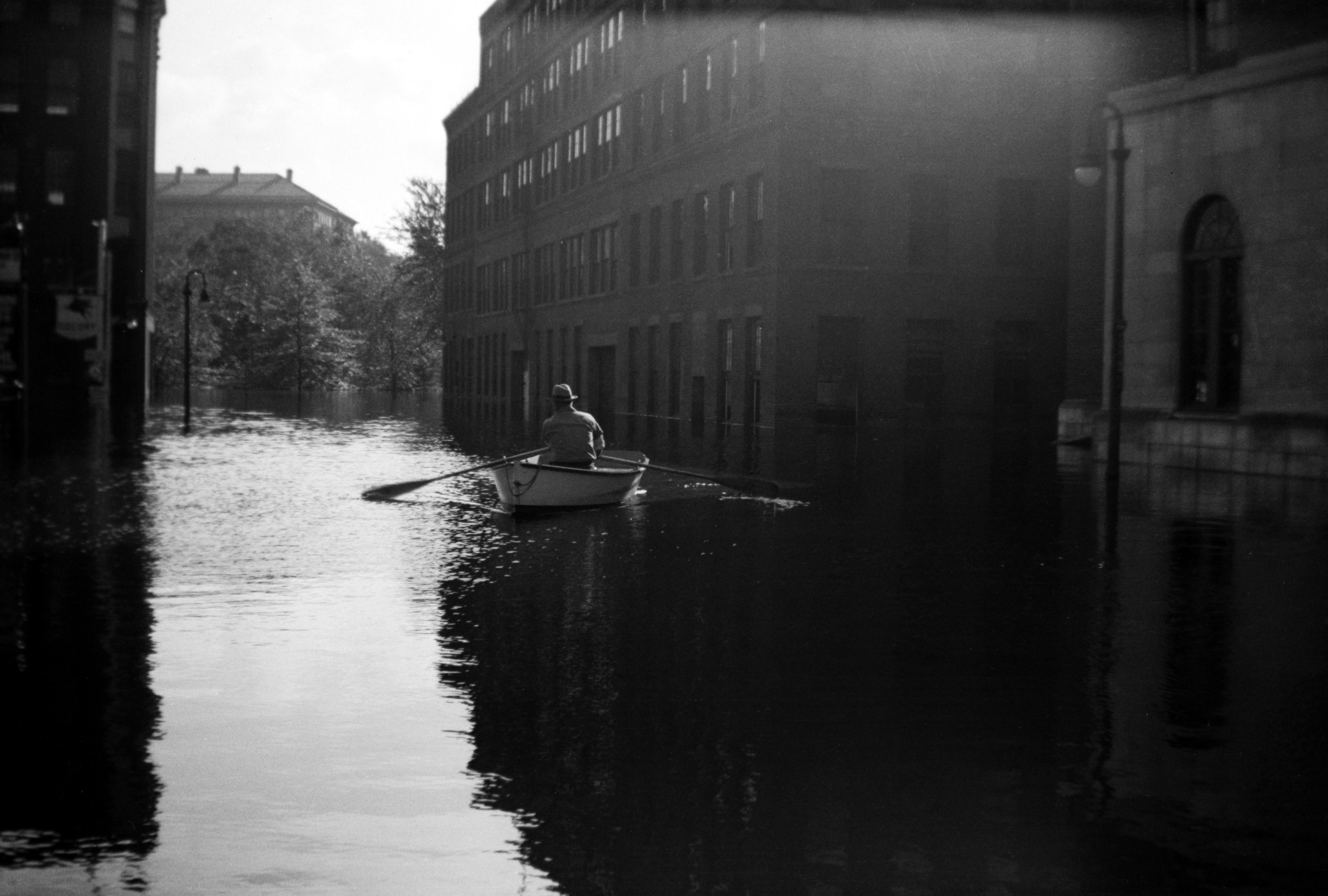A rowboat on a flooded Hartford street
