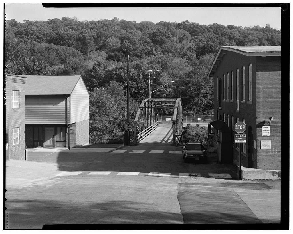 View southeast, general view showing bridge and setting from west end of bridge, river street near intersection with main street · September 1998