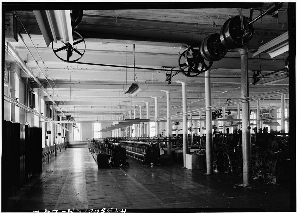 Interior typical of first, second, and third floors showing heavy timber mill construction