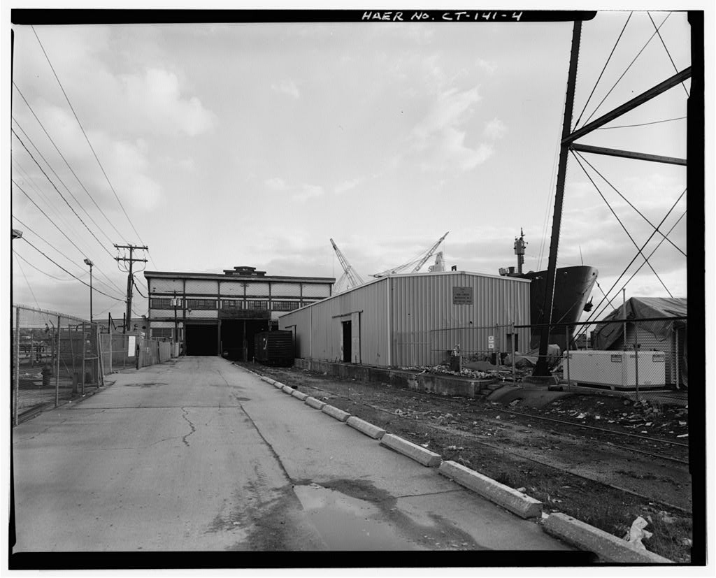 View southeast, end view of main warehouse, land side