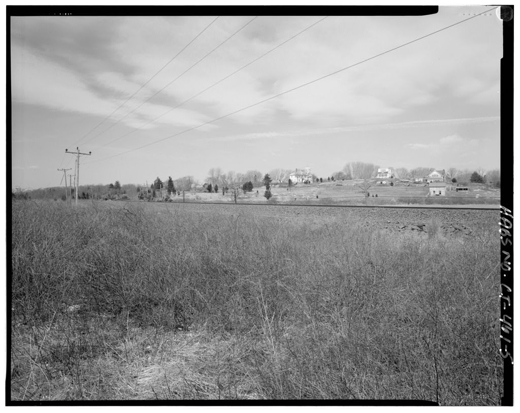 View from beach, looking southwest over railroad tracks towards Latimer Point
