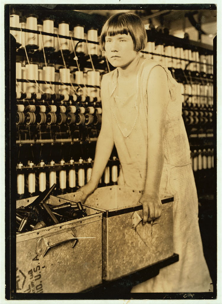 Young worker beside a wagon at the Cheney mills · 1924.