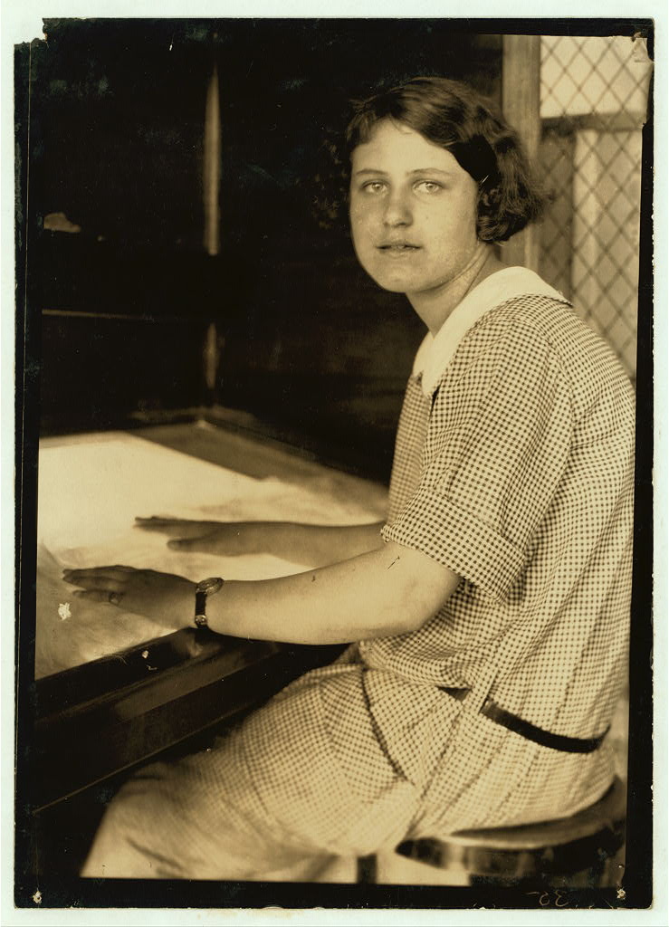 Portrait at a textile inspection table