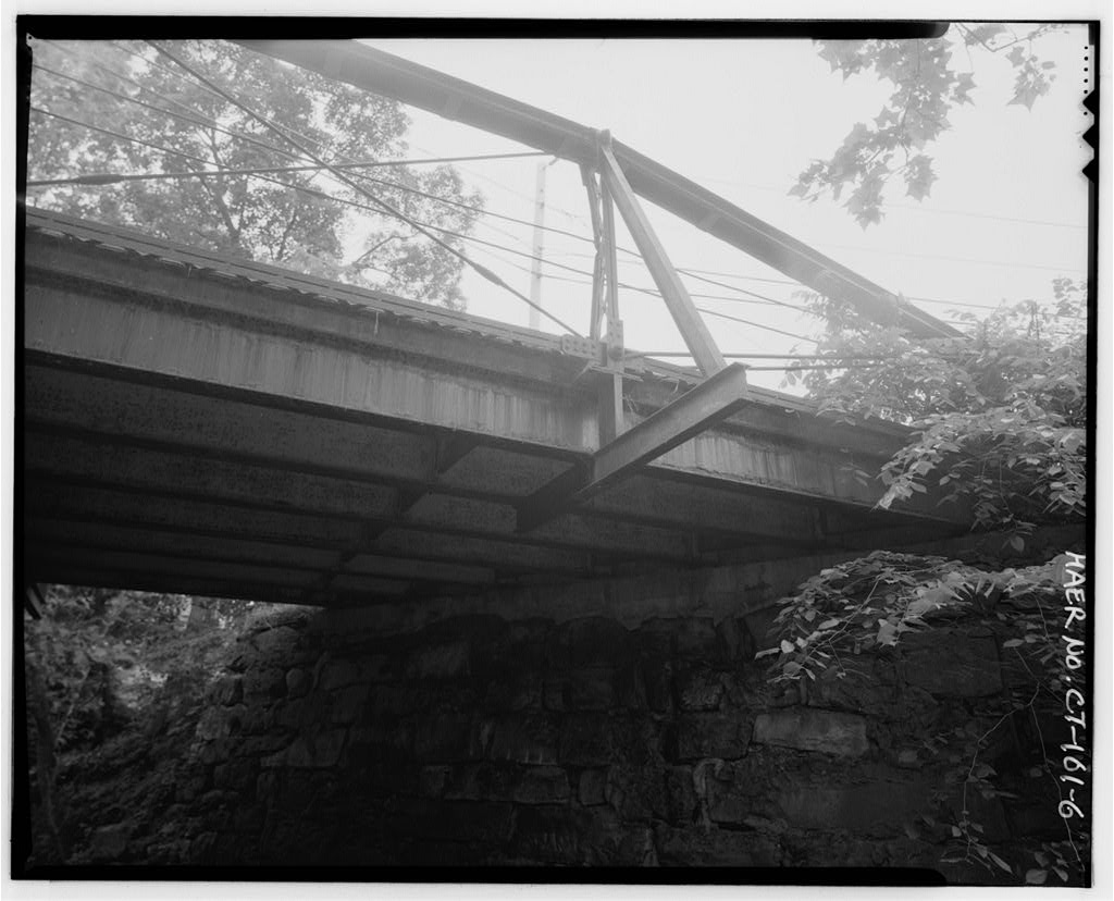 View southwest, showing west abutment and north elevation