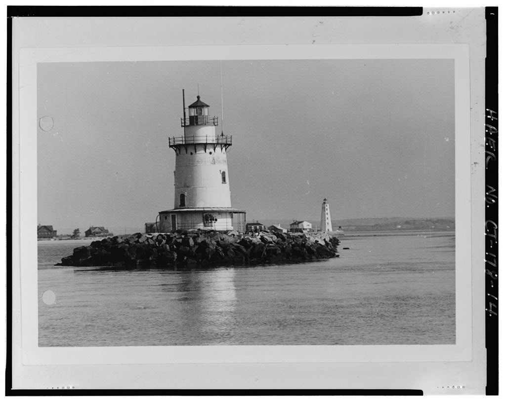 Photo copy of historic photograph, 1972, VIEW LOOKING NORTH, SHOWING ORIGINAL AWNING AT BASE OF LIGHTHOUSE. U.S. Coast Guard Civil Engineering Unit, Warwick, RI - Saybrook Breakwater Light, South tip of west end of Saybrook Breakwater, Old Saybrook, Middlesex County, CT · 1972